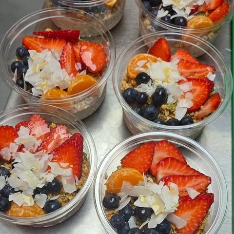 Pots of overnight oats topped with fresh fruit